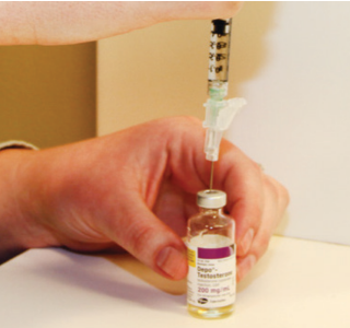 Inserting the syringe into the vial